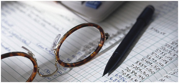 Patricia Amy Bolin glasses atop a ledger book for an Accounting Client